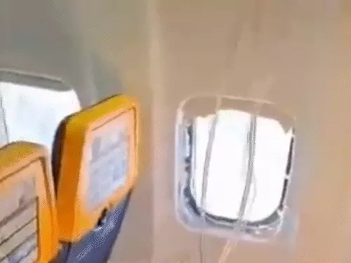 Flight Window Breaks: Major mid-air mishap averted! Passenger's head and shoulder pulled outwards after window shattered... wife turned guardian angel.