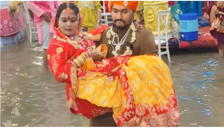 Viral Wedding: Two feet of water... floating footwear... and the bride being carried in arms! A 'Monsoon Wedding' has become the talk of social media.