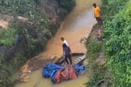 Truck Accident: Speeding truck plunges 70 feet into a raging drain; driver's body recovered after cutting open the cabin.