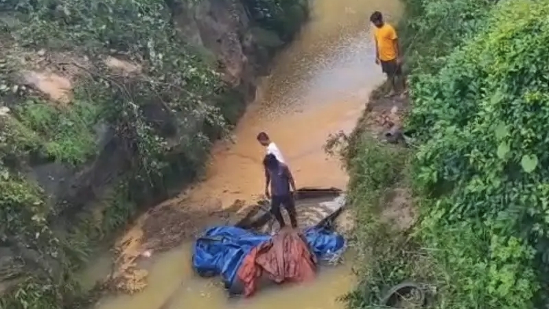 Truck Accident: Speeding truck plunges 70 feet into a raging drain; driver's body recovered after cutting open the cabin.
